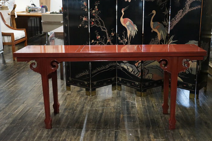 A unique expandable altar style console by Baker Furniture. From Michael Taylor's Far East Collection, circa 1960. Red Lacquer finish.  Small space solutions.