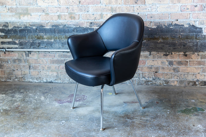 Saarinen Executive Chair one of Knoll's most popular designs for 70 years. Designed by Eero Saarinen in 1950. Supple black leather with aluminum legs.  Chicago