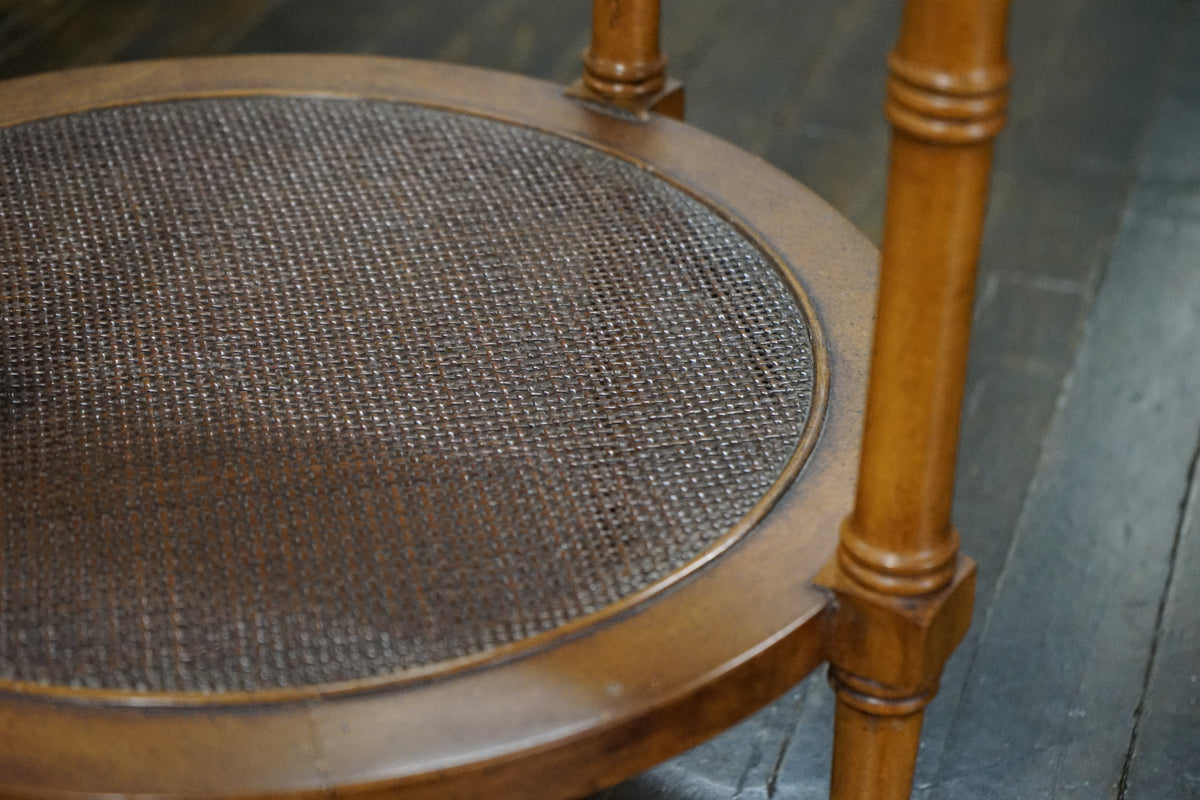 Midcentury accent table that has faux bamboo legs, a glass insert at the top, a lovely pierced metal trim detail.  Faux bamboo legs, cane shelf.  chicago