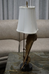 A stunning table lamp by Chapman (circa 1990's). The lamp features 2 palm fronds in brass that appear to be bent or swaying. Chicago, Studio Sonja Milan