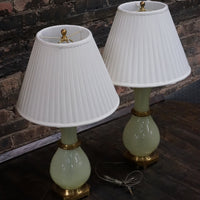 Lovely pair of Paul Hanson bronze mounted Vaseline glass lamps done in the Hollywood Regency style. The glass is almost a chartreuse color 