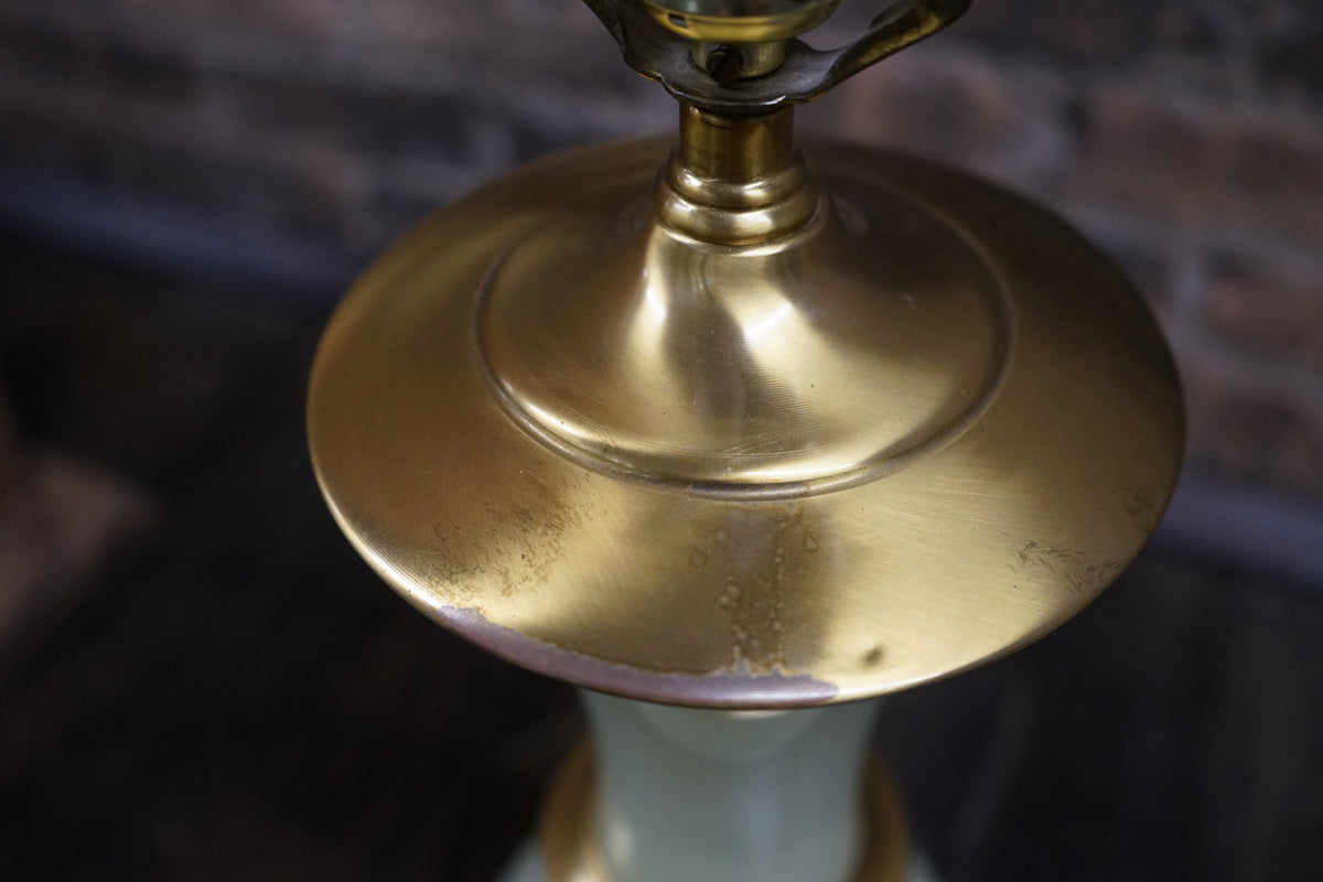 Lovely pair of Paul Hanson bronze mounted Vaseline glass lamps done in the Hollywood Regency style. The glass is almost a chartreuse color 