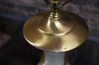 Lovely pair of Paul Hanson bronze mounted Vaseline glass lamps done in the Hollywood Regency style. The glass is almost a chartreuse color 