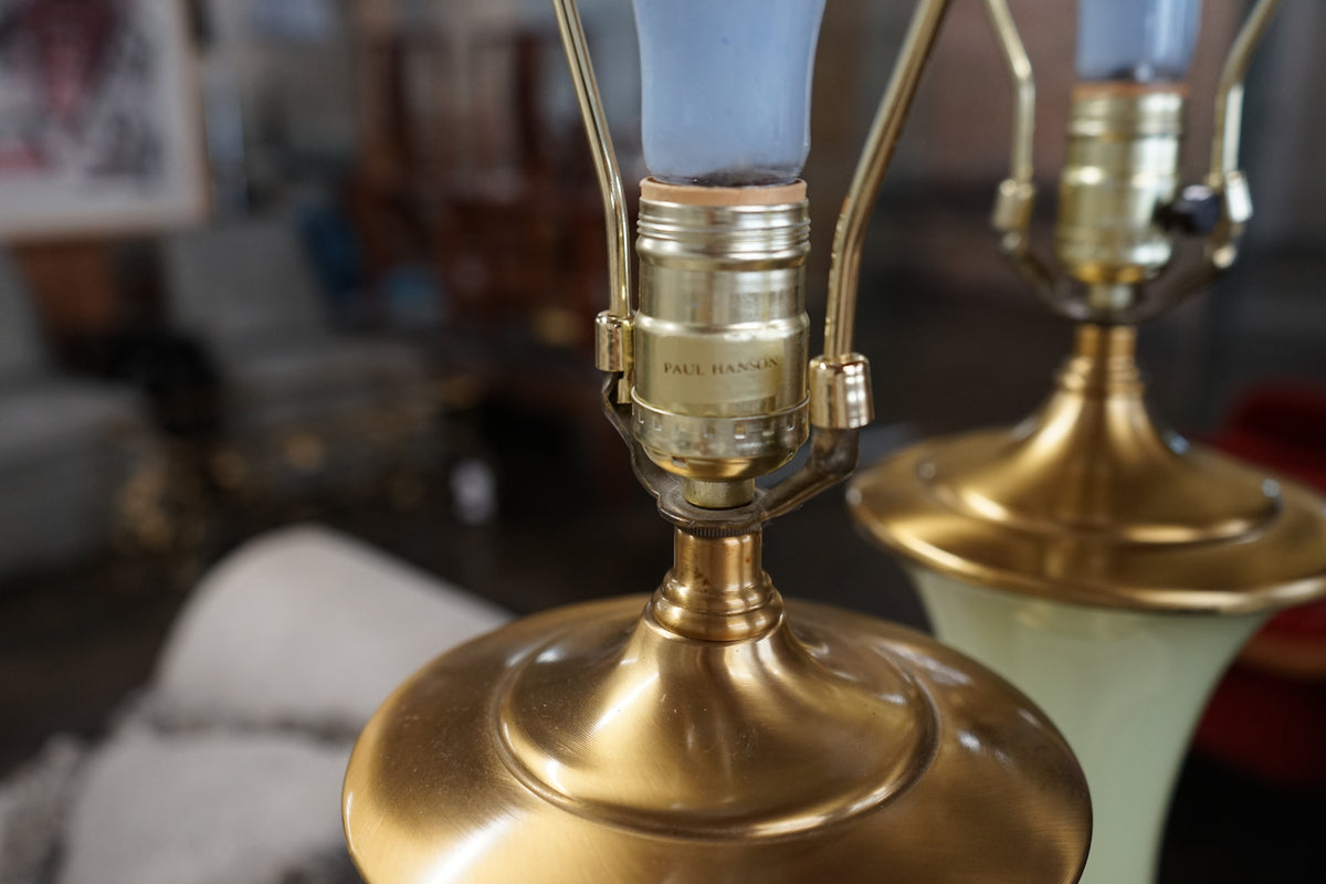 Lovely pair of Paul Hanson bronze mounted Vaseline glass lamps done in the Hollywood Regency style. The glass is almost a chartreuse color 