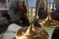 Lovely pair of Paul Hanson bronze mounted Vaseline glass lamps done in the Hollywood Regency style. The glass is almost a chartreuse color 
