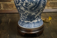 Beautiful blue and white ginger jar lamp by Frederick Cooper. The lamp has an Asian motif painted in the body and it features a dragon.