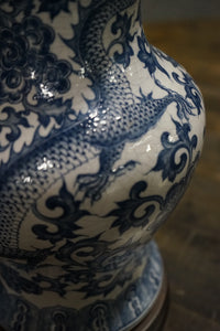 Beautiful blue and white ginger jar lamp by Frederick Cooper. The lamp has an Asian motif painted in the body and it features a dragon.