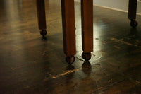 A great set of four John Widdicomb Parsons style dining chairs on castors. This set has its original upholstery. Studio Sonja Milan, Chicago, IL