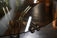 A mid-century modern bistro table with a chrome base and smoke glass top (that is 36" round). Chicago, IL Studio Sonja Milan