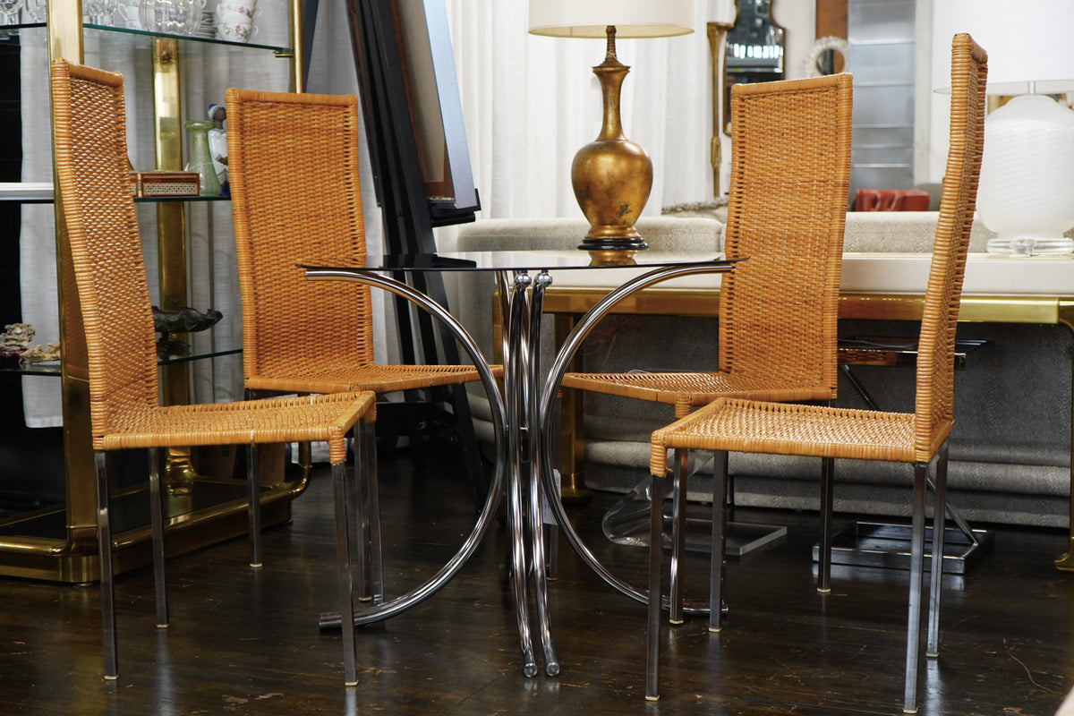 A mid-century modern bistro table with a chrome base and smoke glass top (that is 36" round). Chicago, IL Studio Sonja Milan