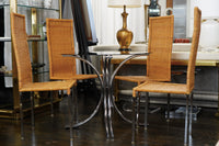 A mid-century modern bistro table with a chrome base and smoke glass top (that is 36" round). Chicago, IL Studio Sonja Milan