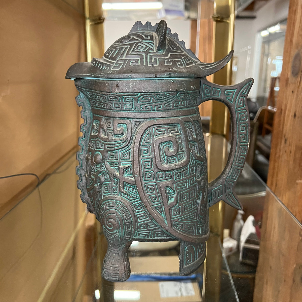 A set of James Mont-style metal (faux bronze) with verdigris finish which includes an ice bucket and water pitcher. Both items are made of metal with green plastic insulation inserts Great unique wedding gift.  Midcentury barware.