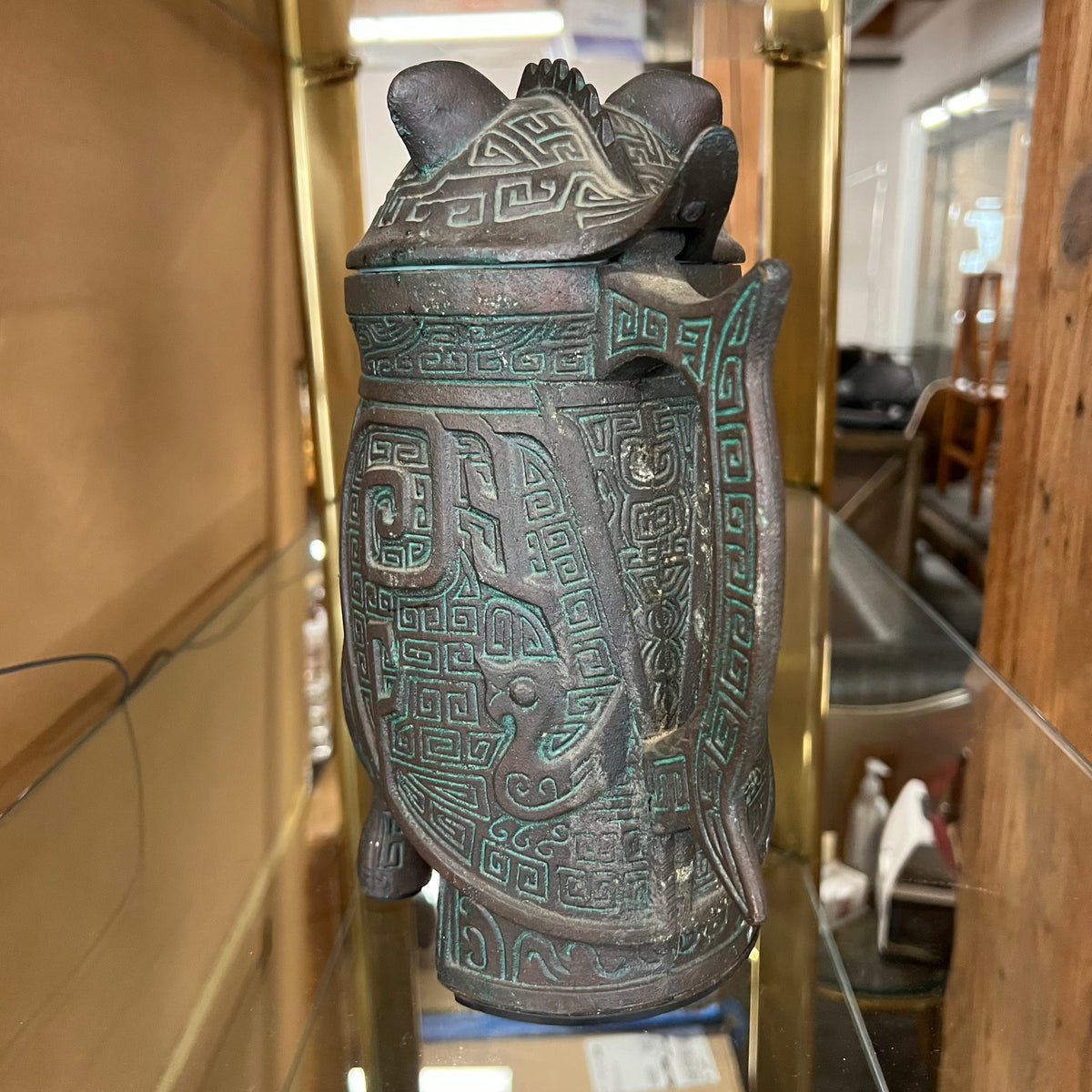 A set of James Mont-style metal (faux bronze) with verdigris finish which includes an ice bucket and water pitcher. Both items are made of metal with green plastic insulation inserts Great unique wedding gift.  Midcentury barware.