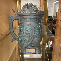 A set of James Mont-style metal (faux bronze) with verdigris finish which includes an ice bucket and water pitcher. Both items are made of metal with green plastic insulation inserts Great unique wedding gift.  Midcentury barware.