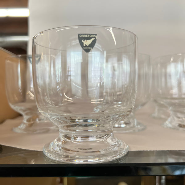 wide mouthed footed glass Orrefors bowls were most likely designed for use as an individual dessert bowl; berries, trifle, parfait, ice cream.  They are in perfect condition.  Set of 10.  