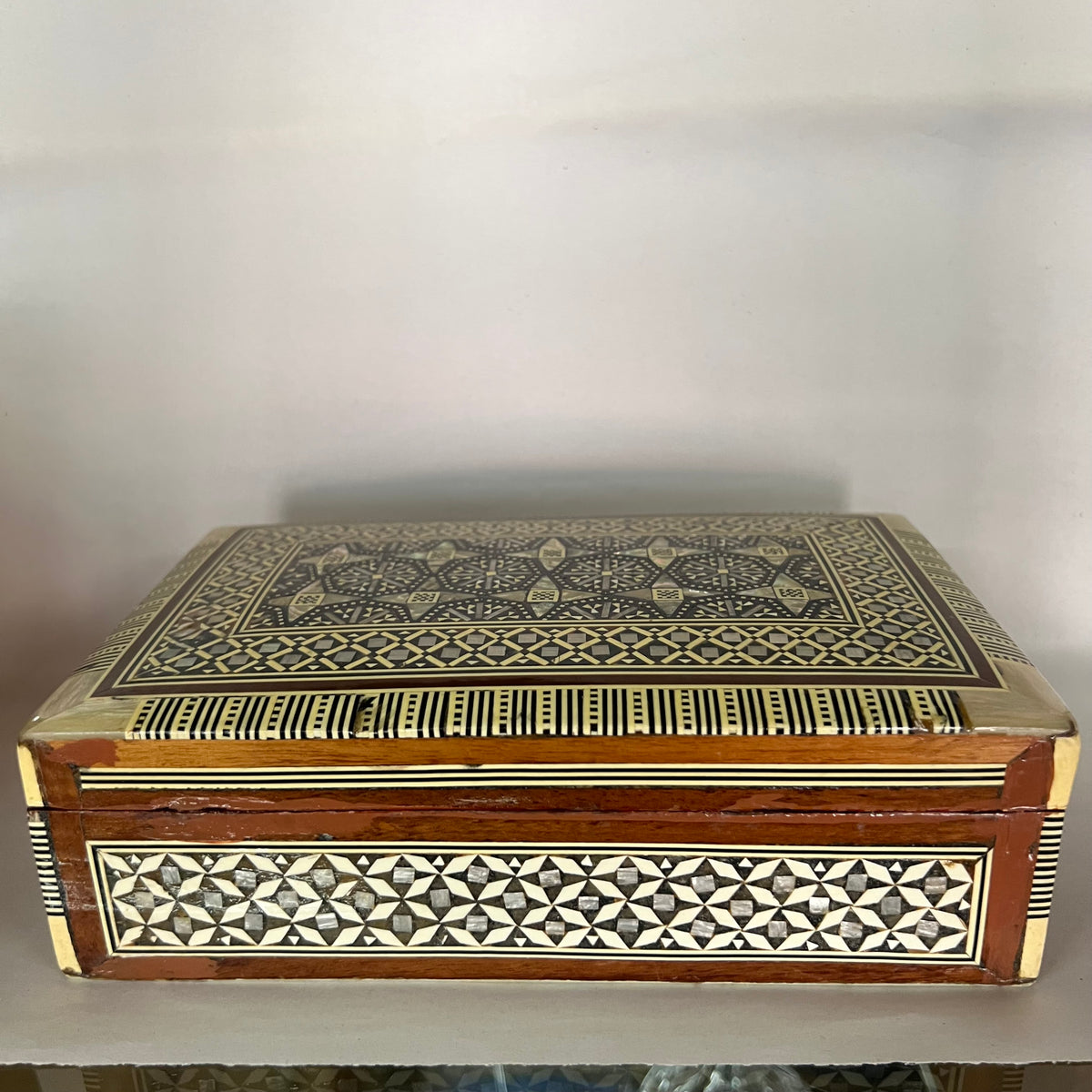 Stunning handcrafted decorative wood box with mosaic marquetry design. Vintage Moorish style box features geometric inlays in mother of pearl 
