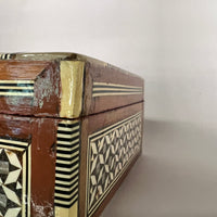 Mosiac box circa 1950's-1960's, inlaid with mother-of-pearl.  Detailed, lovely, lined in velvet.