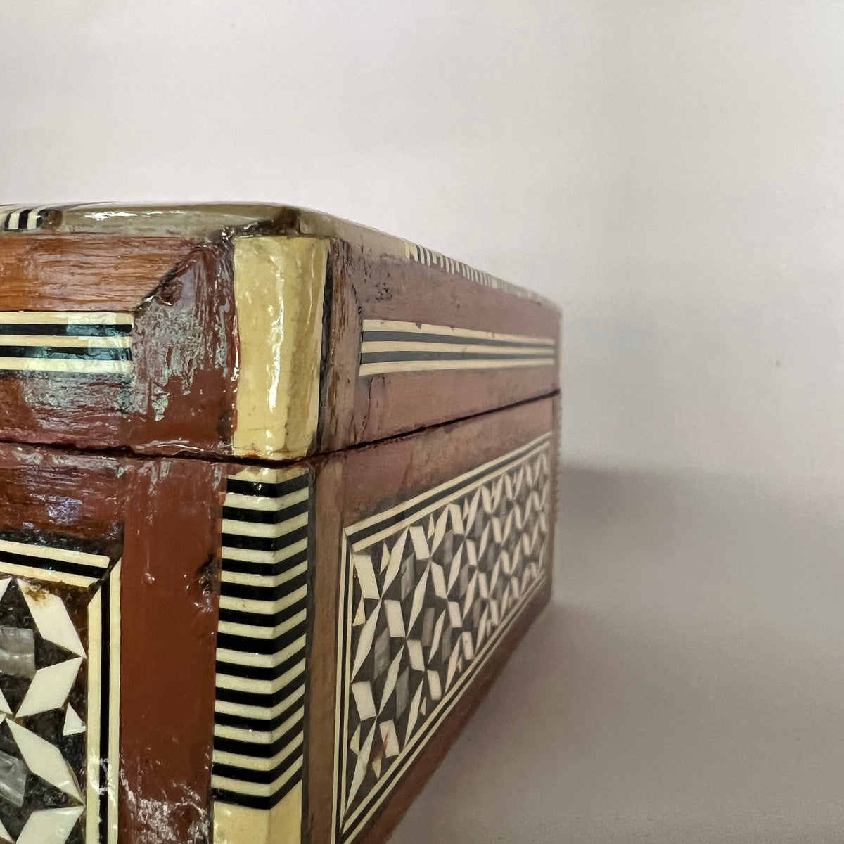 Mosiac box circa 1950's-1960's, inlaid with mother-of-pearl.  Detailed, lovely, lined in velvet.