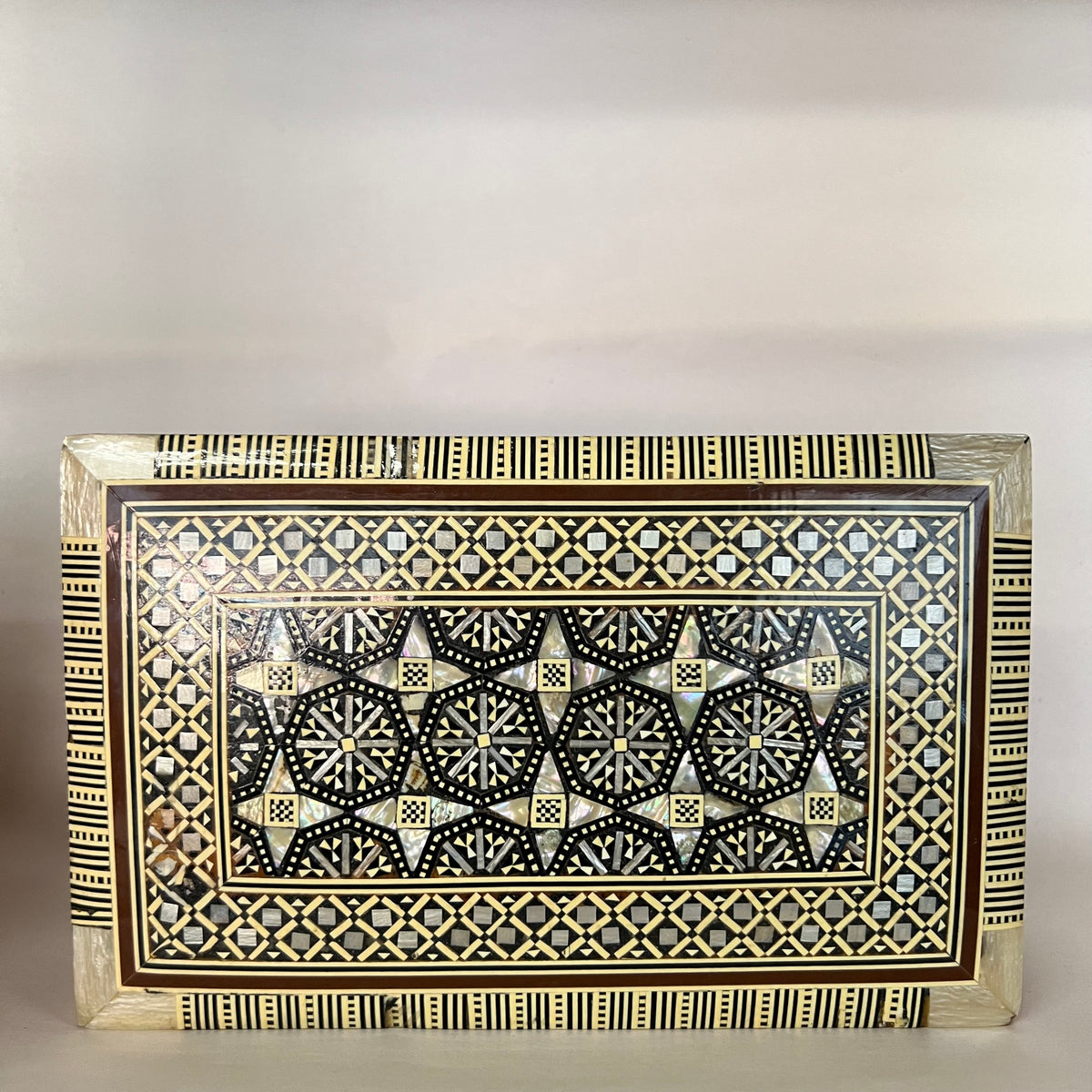 Mosiac box circa 1950's-1960's, inlaid with mother-of-pearl.  Detailed, lovely, lined in velvet.