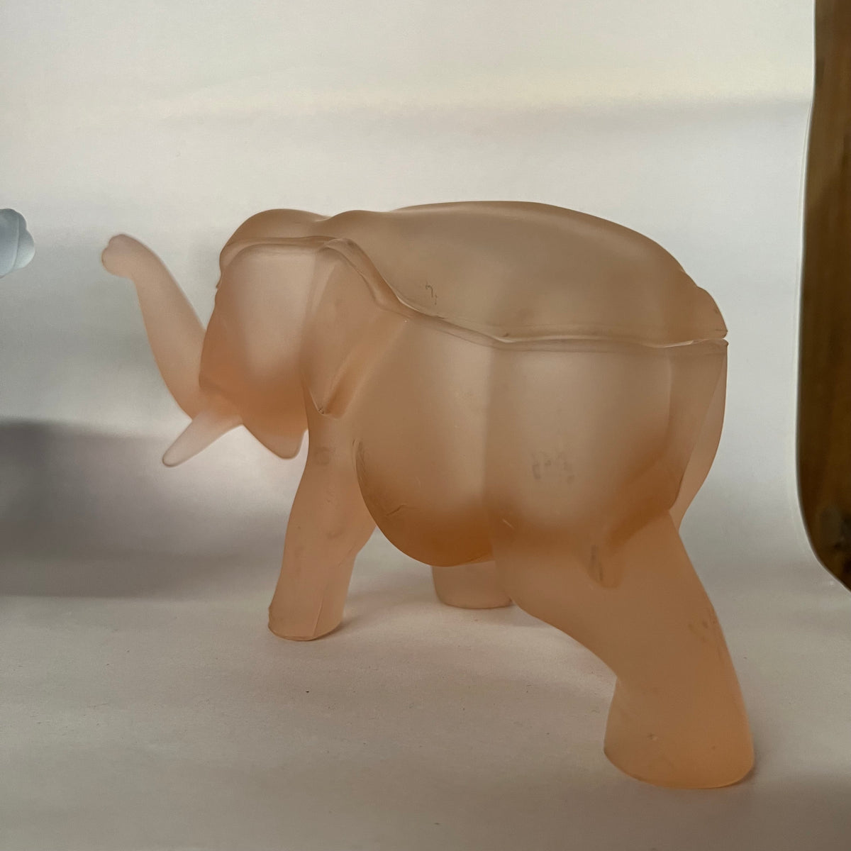 Made by Indiana Glass for Tiara, this glass elephant lidded trinket box is as unique as it is functional. Perfect for everything from buttons to jewelry to candy and more. Dates to the 1980s.
