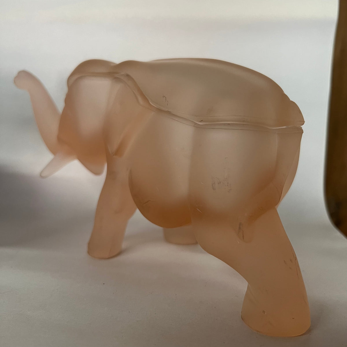 Made by Indiana Glass for Tiara, this glass elephant lidded trinket box is as unique as it is functional. Perfect for everything from buttons to jewelry to candy and more. Dates to the 1980s.