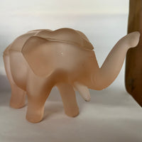 Made by Indiana Glass for Tiara, this glass elephant lidded trinket box is as unique as it is functional. Perfect for everything from buttons to jewelry to candy and more. Dates to the 1980s.