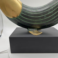 This is a beautiful modern brass and metal fish statue mounted on a stand made by Dolbi Cashier in 1990. Dolbi Cashier produced high-end decorative objects which were designed by owner Ed Schulman.  Lovely modern fish sculpture. Coastal Decor