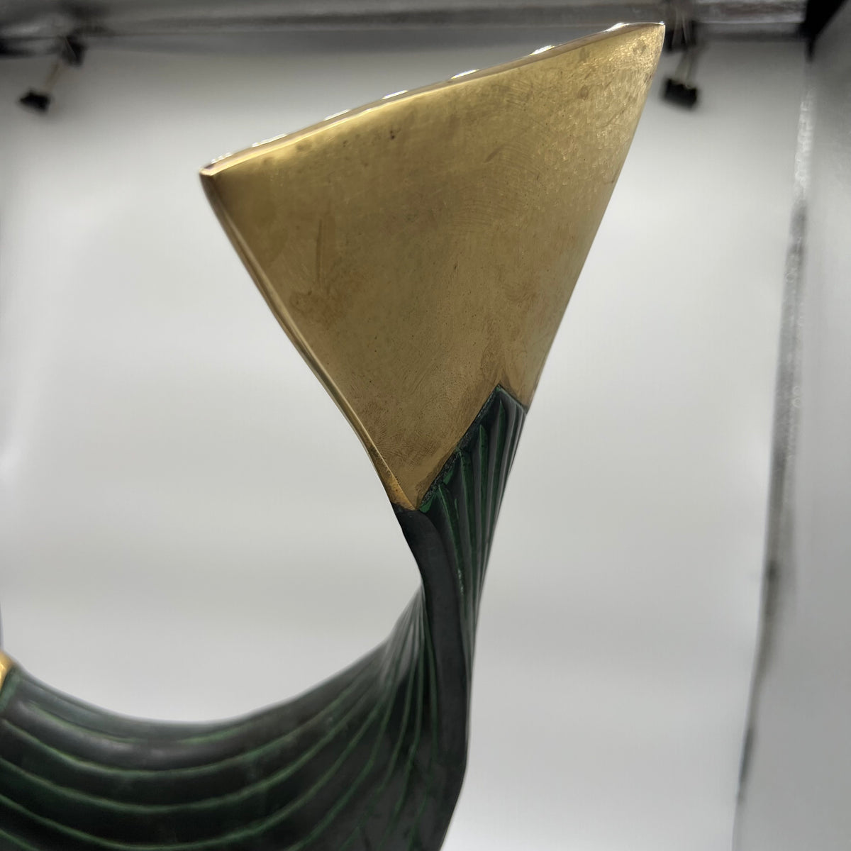 This is a beautiful modern brass and metal fish statue mounted on a stand made by Dolbi Cashier in 1990. Dolbi Cashier produced high-end decorative objects which were designed by owner Ed Schulman.  Lovely modern fish sculpture. Coastal Decor