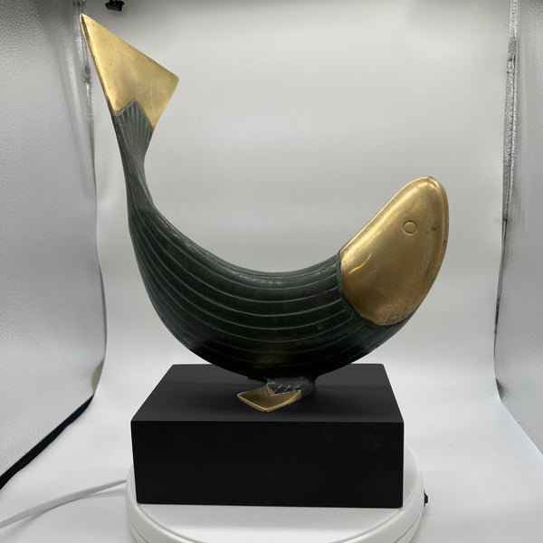 This is a beautiful modern brass and metal fish statue mounted on a stand made by Dolbi Cashier in 1990. Dolbi Cashier produced high-end decorative objects which were designed by owner Ed Schulman.  Lovely modern fish sculpture. Coastal Decor