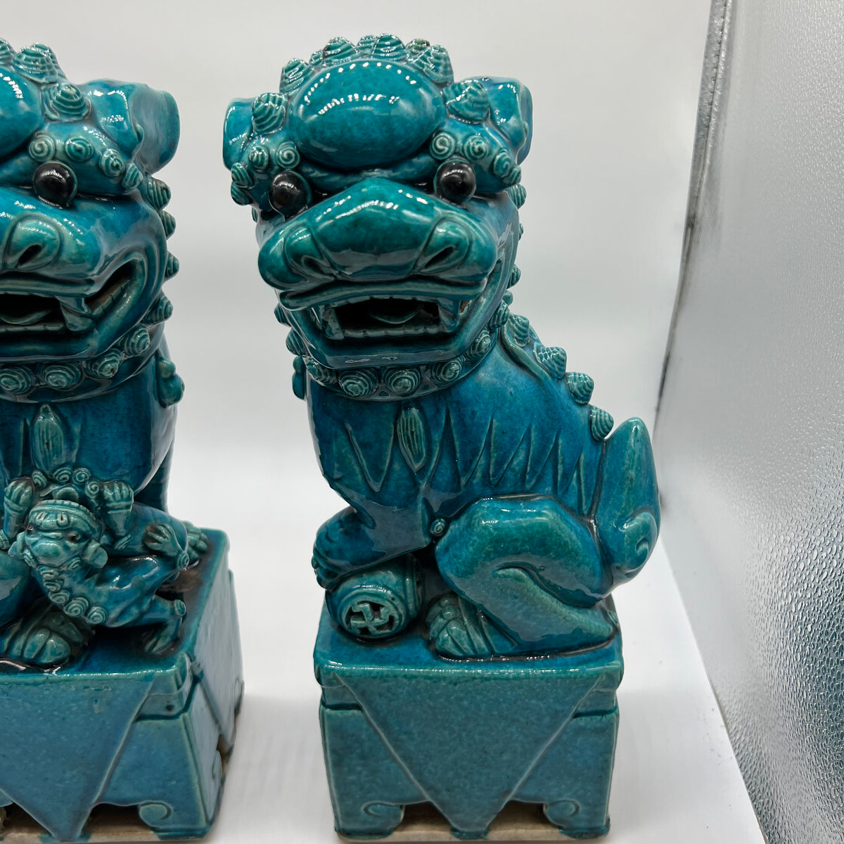 Large and lovely pair of Chinese Foo Dogs, biscuit-turquoise colored male and female foo dogs. &nbsp;Circa 1880