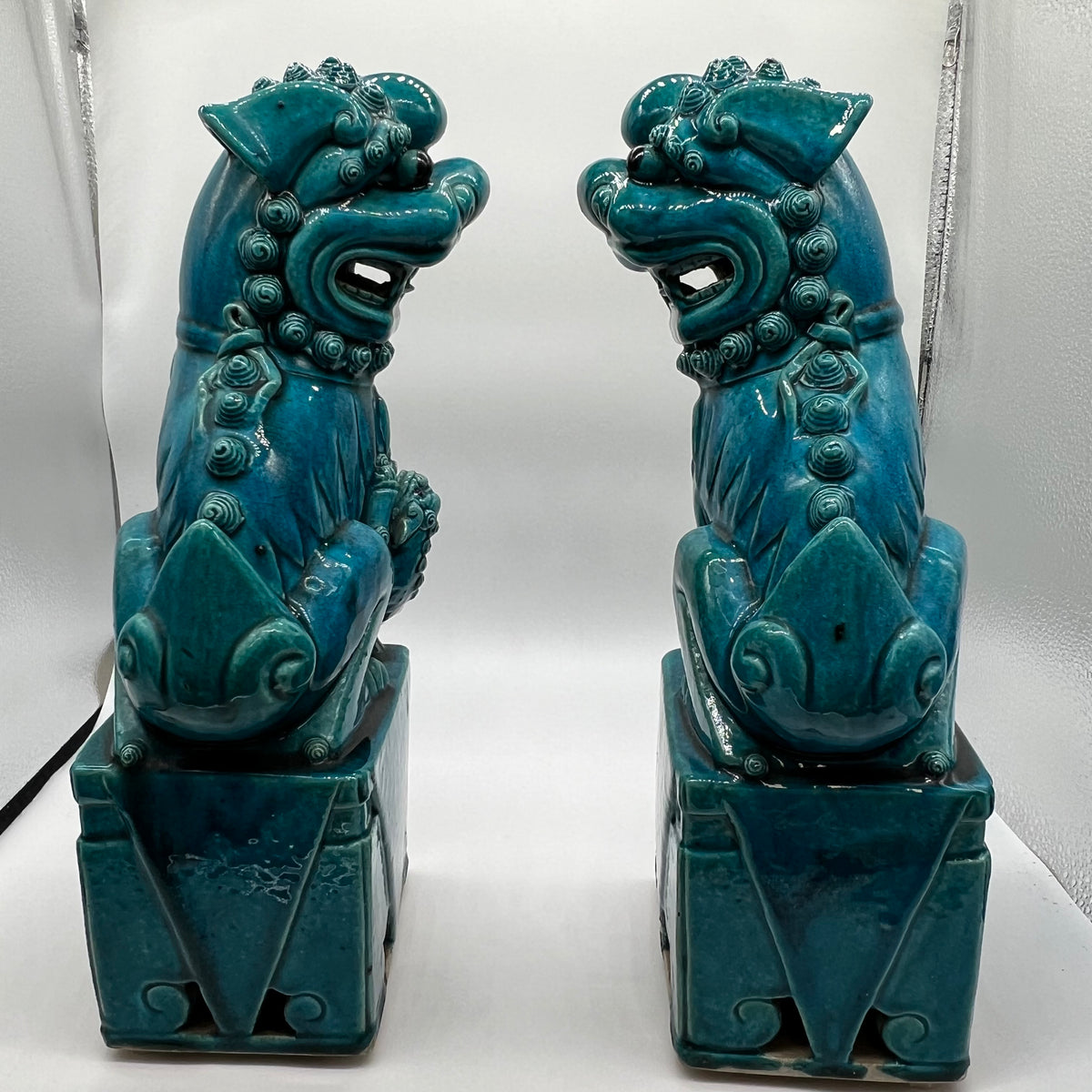 Large and lovely pair of Chinese Foo Dogs, biscuit-turquoise colored male and female foo dogs. &nbsp;Circa 1880