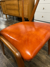 Mid century walnut dining chair by Bertha Schaefer for Singer & Sons, original orange leather upholstered seats. Made in Italy. Set of 8 available.  Chicago