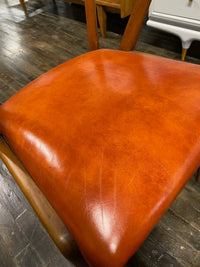 Mid century walnut dining chair by Bertha Schaefer for Singer & Sons, original orange leather upholstered seats. Made in Italy. Set of 8 available.  Chicago