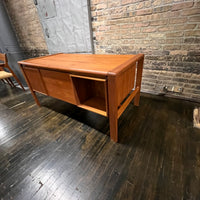 Mid-century executive floating top desk by H.P. Hansen manufactured in Demark circa 1970s. This beautiful desk was made of the highest quality teak.  The back of the desk is completely finished and has one inset opening that can be used for book storage or to display decorative items. STUDIO SONJA MILAN, Chicago, IL