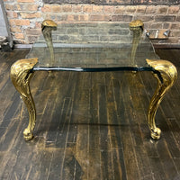 Lovely mid-century side table  with 4 brass legs that support a floating fluted glass top.  In the style and manner of Maison Jansen and P.E. Guerin