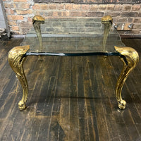 Lovely mid-century side table  with 4 brass legs that support a floating fluted glass top.  In the style and manner of Maison Jansen and P.E. Guerin