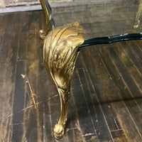 Lovely mid-century side table  with 4 brass legs that support a floating fluted glass top.  In the style and manner of Maison Jansen and P.E. Guerin