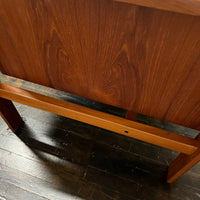 Mid-century executive floating top desk by H.P. Hansen manufactured in Demark circa 1970s. This beautiful desk was made of the highest quality teak.  The back of the desk is completely finished and has one inset opening that can be used for book storage or to display decorative items. STUDIO SONJA MILAN, Chicago, IL