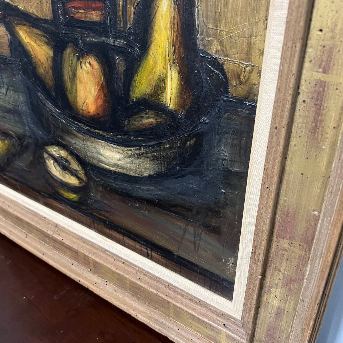 Stunning still life of fruit by German artist Franz Priking. Painted primarily in shades of gold, deep green and black and housed in a beautiful frame that has gilded accents.  Dated 1955, Studio Sonja Milan, Chicago, IL