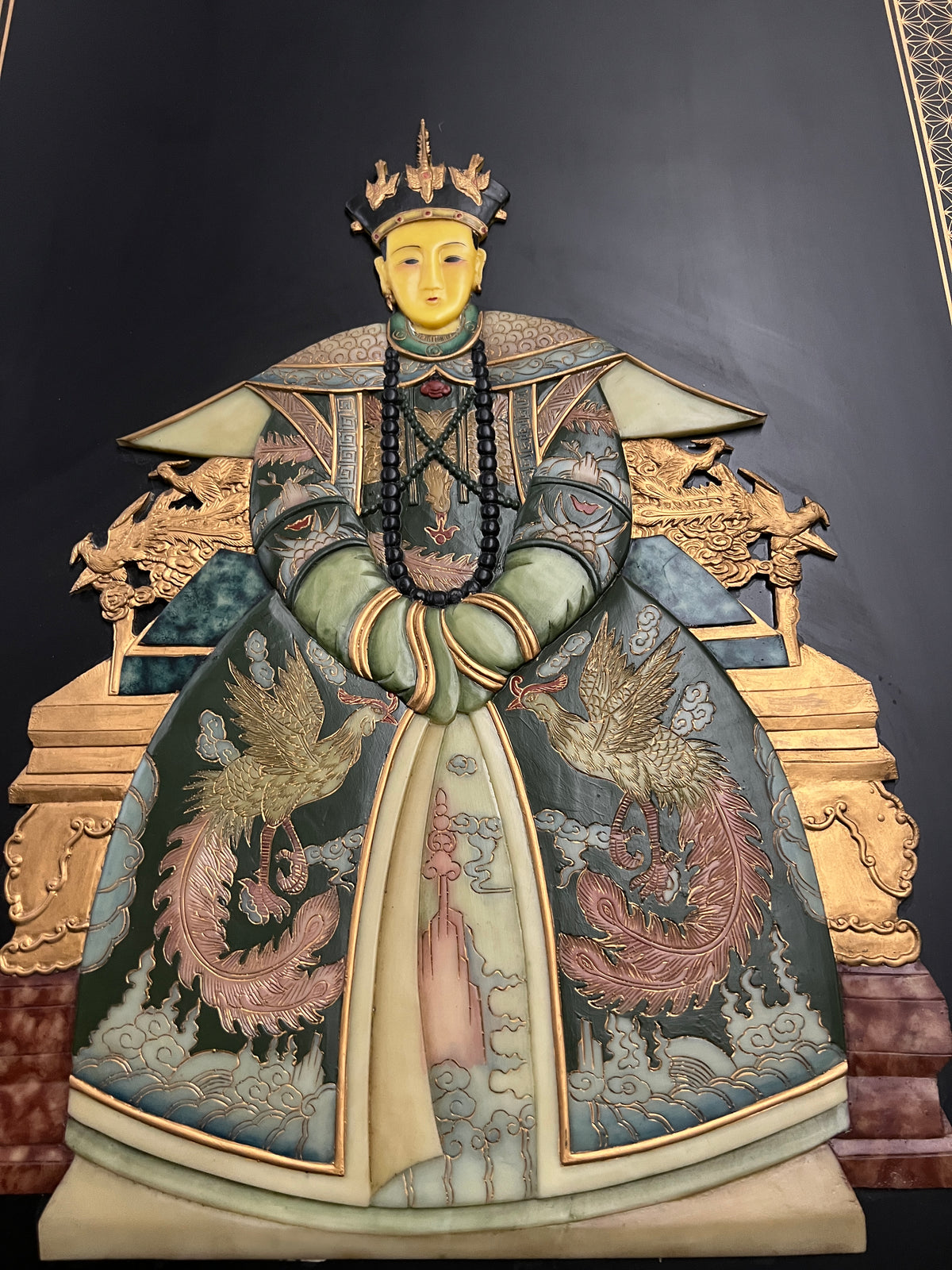 Lovely and large pair of chinoiserie art pieces on wood board.  The images of the emperor and empress are somewhat two dimensional.