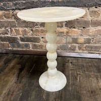 Lovely petite natural stone mid-century cocktail or drinks table.  It has a round base and a bobbin style support with a round table top.   It is primarily off-white with gray and some gold.  It is lovely.  No chips.  11.75" diameter.  Studio Sonja Milan, Chicago, IL Mid-century modern Furniture Chicago