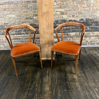 Pair of Mid century walnut dining chair designed by Bertha Schaefer for Singer & Sons (the original labels are missing).  The chair are in excellent original condition.  The seats were just rewebbed and reupholstered in a spice colored velvet.  One of the most stunning examples of mid-century design. 