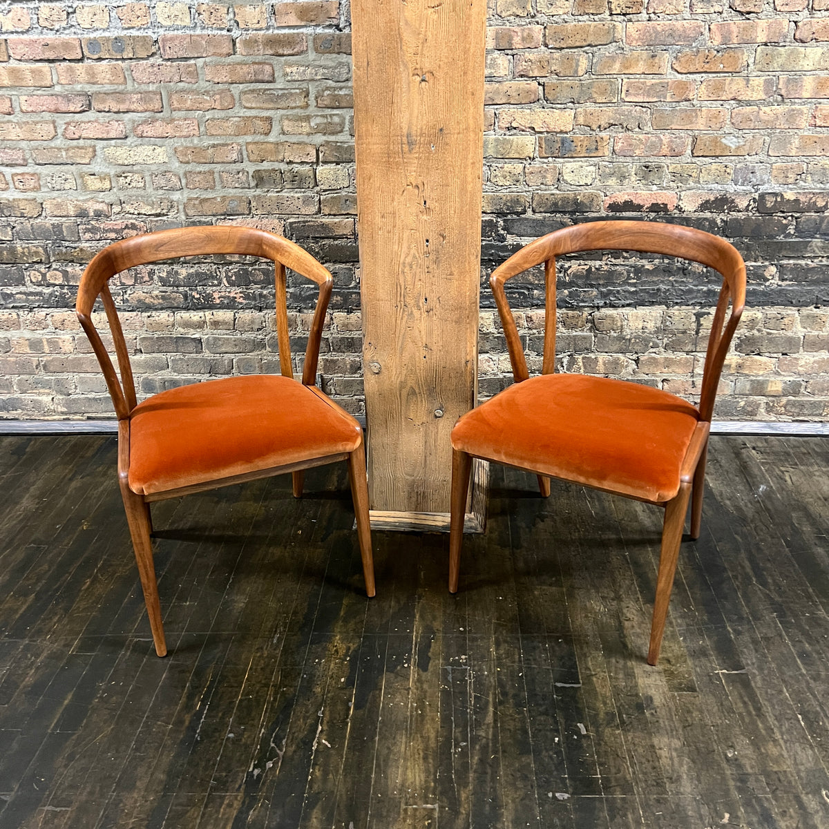 Pair of Mid century walnut dining chair designed by Bertha Schaefer for Singer & Sons (the original labels are missing).  The chair are in excellent original condition.  The seats were just rewebbed and reupholstered in a spice colored velvet.  One of the most stunning examples of mid-century design. 