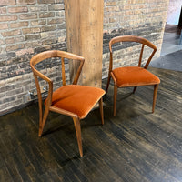 Pair of Mid century walnut dining chair designed by Bertha Schaefer for Singer & Sons (the original labels are missing).  The chair are in excellent original condition.  The seats were just rewebbed and reupholstered in a spice colored velvet.  One of the most stunning examples of mid-century design. 