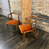 Pair of Mid century walnut dining chair designed by Bertha Schaefer for Singer & Sons (the original labels are missing).  The chair are in excellent original condition.  The seats were just rewebbed and reupholstered in a spice colored velvet.  One of the most stunning examples of mid-century design. 