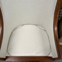 Pair of chairs with lovely solid walnut frames and very light gray linen upholstery (on the front of the chair and the seat cushions). The seat cushions are down filled. The back of the chair is upholstered in a coordinating cut velvet that has shades of cream, black and gray. 