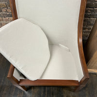 Pair of chairs with lovely solid walnut frames and very light gray linen upholstery (on the front of the chair and the seat cushions). The seat cushions are down filled. The back of the chair is upholstered in a coordinating cut velvet that has shades of cream, black and gray. 