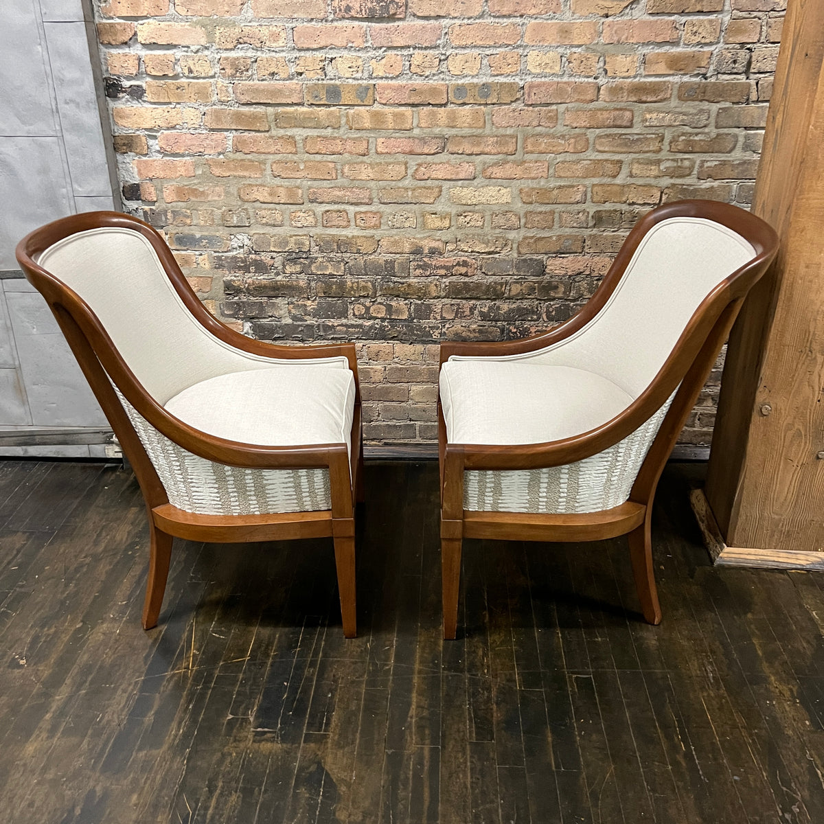 Pair of chairs with lovely solid walnut frames and very light gray linen upholstery (on the front of the chair and the seat cushions). The seat cushions are down filled. The back of the chair is upholstered in a coordinating cut velvet that has shades of cream, black and gray. 