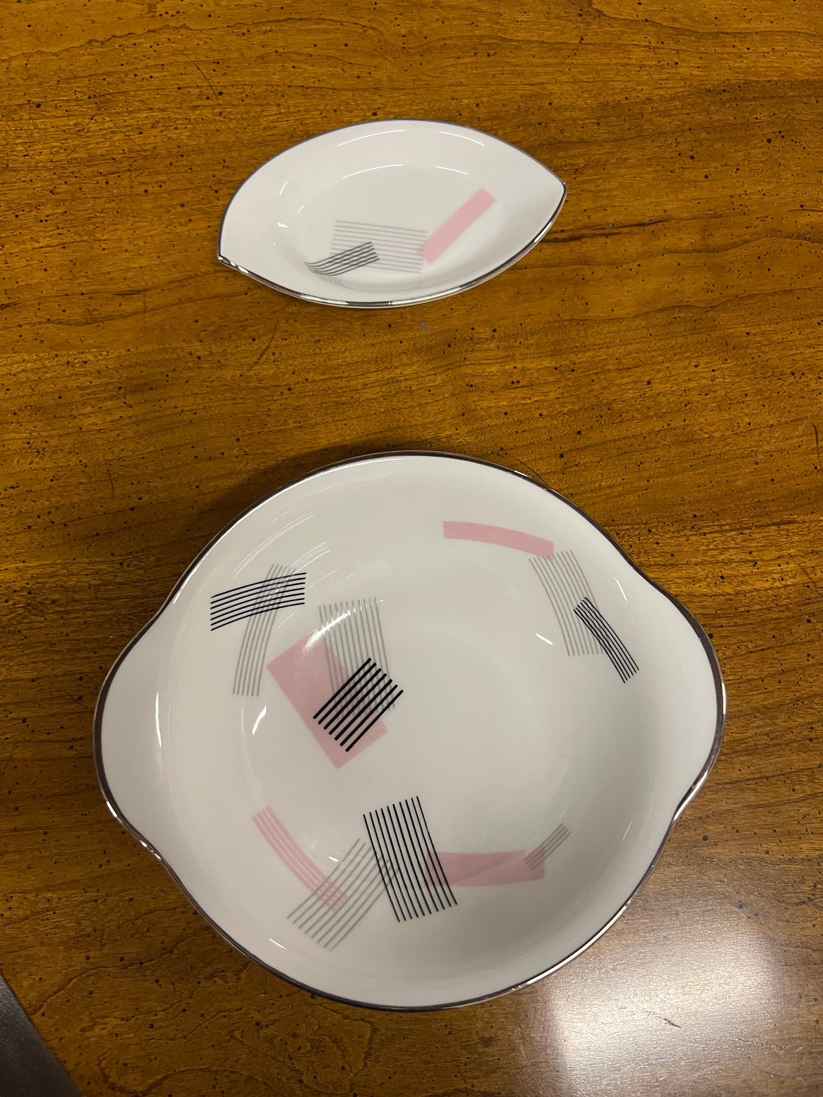 Noritake dinner service for 8 - pattern is number 1357. It has a pink and black pattern - very retro. The set was initially for 12...but as pieces were lost over the years there are now only 9 full sets plus a few extra pieces.  Studio Sonja Milan, Chicago, IL