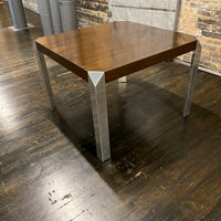 Stunning and unique mid-century dining table by Baker Furniture that features a rich brown wood top and triangular shaped polished chrome legs. Studio Sonja Milan, Chicago, IL